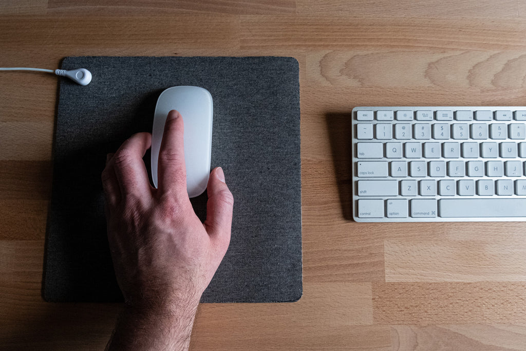 Ease muscle tension with a grounded silver-threaded earthing mouse pad