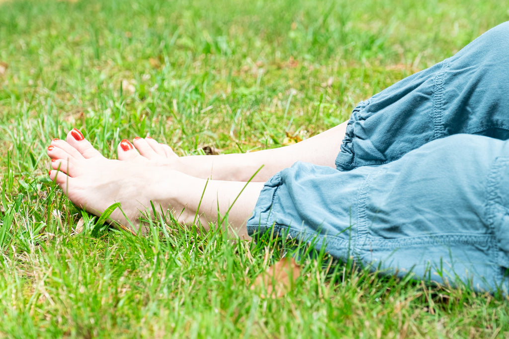 Earthing barefoot on the grass