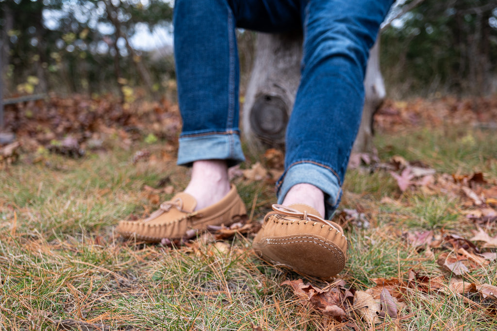 Connecting to the ground and earth wearing a pair of all-leather moccasin shoes