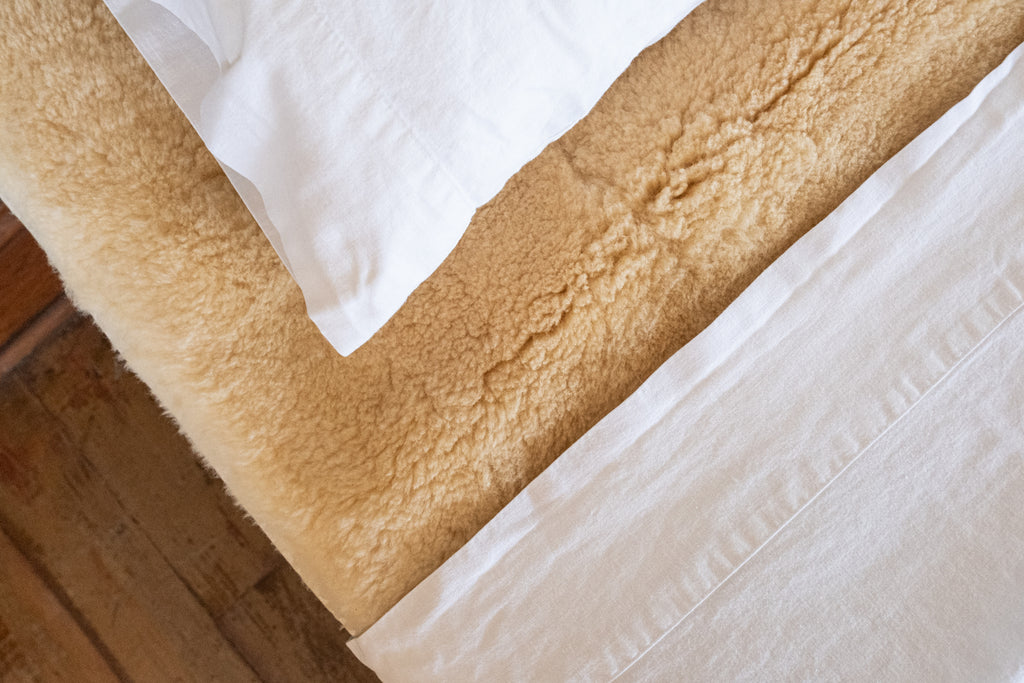 sleep on luxurious wool with this sheepskin mattress topper