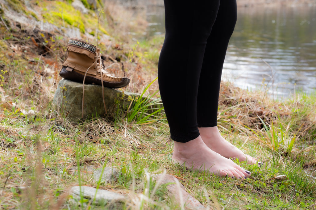 You can practice earthing by wearing either leather soled shoes or going barefoot on the ground