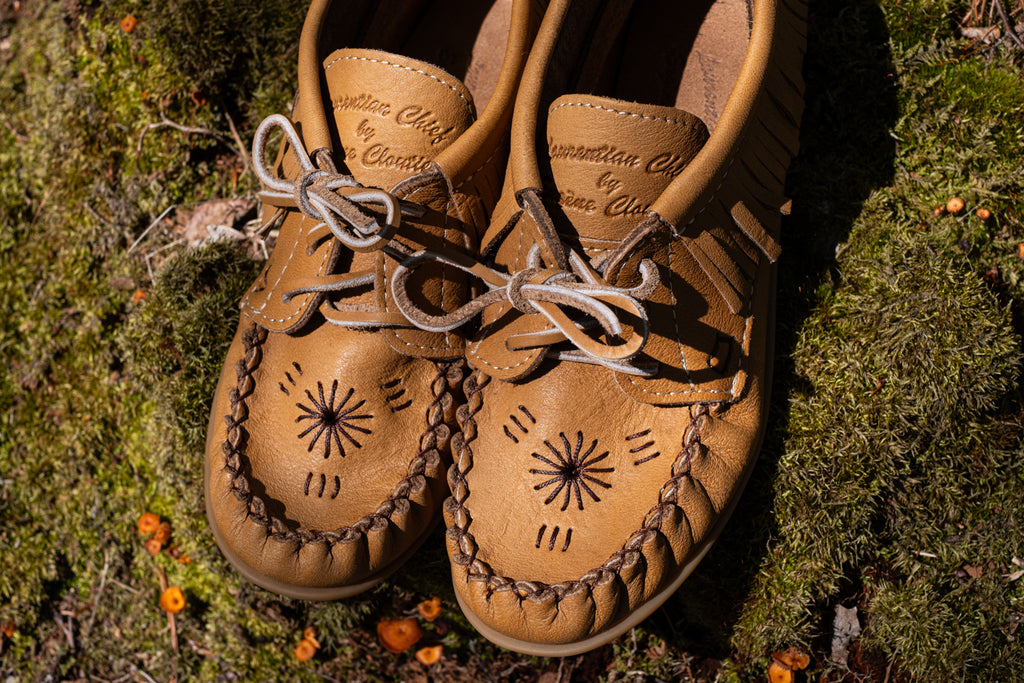 These beautiful genuine leather moccasins have a hand-embroidered design on the vamp and as you can see they are Laurentian Chief by Eugene Cloutier.