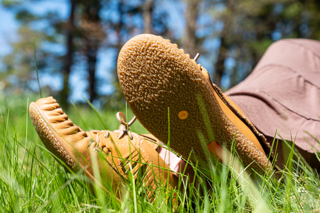 One way you can practice earthing is with shoes that have a copper rivet inserted into the sole since copper is conductive it allows electrons to flow into the soles of your feet.
