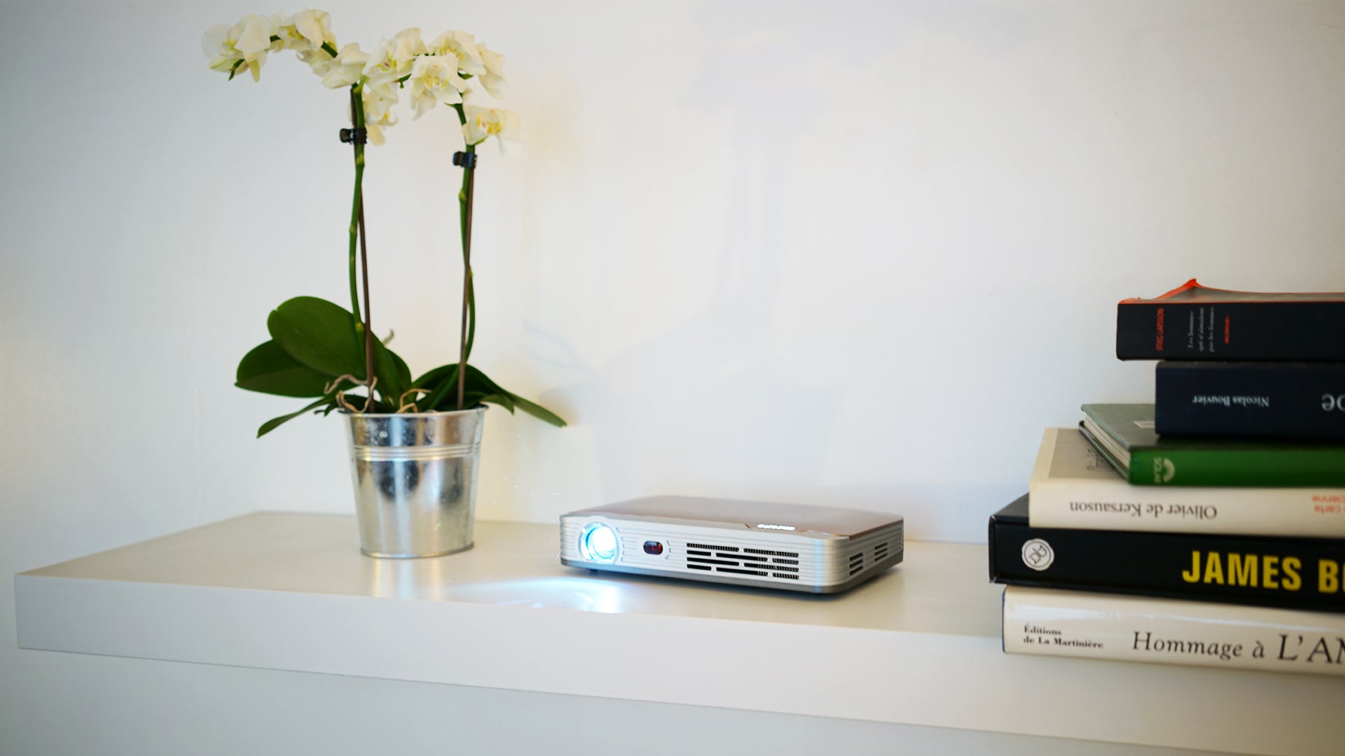 Innovative DS9 4K short throw projector - flower vase and book shelve