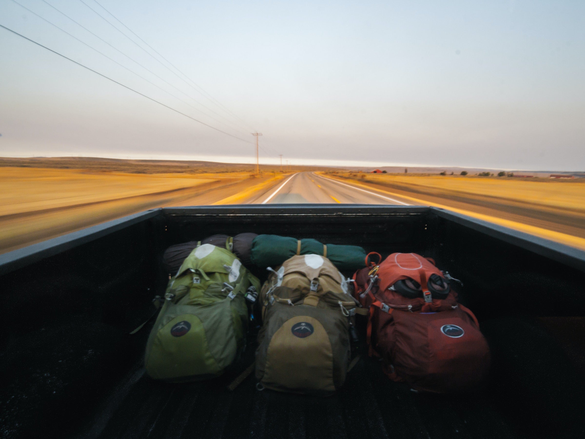 Backpacks in the back of a truck