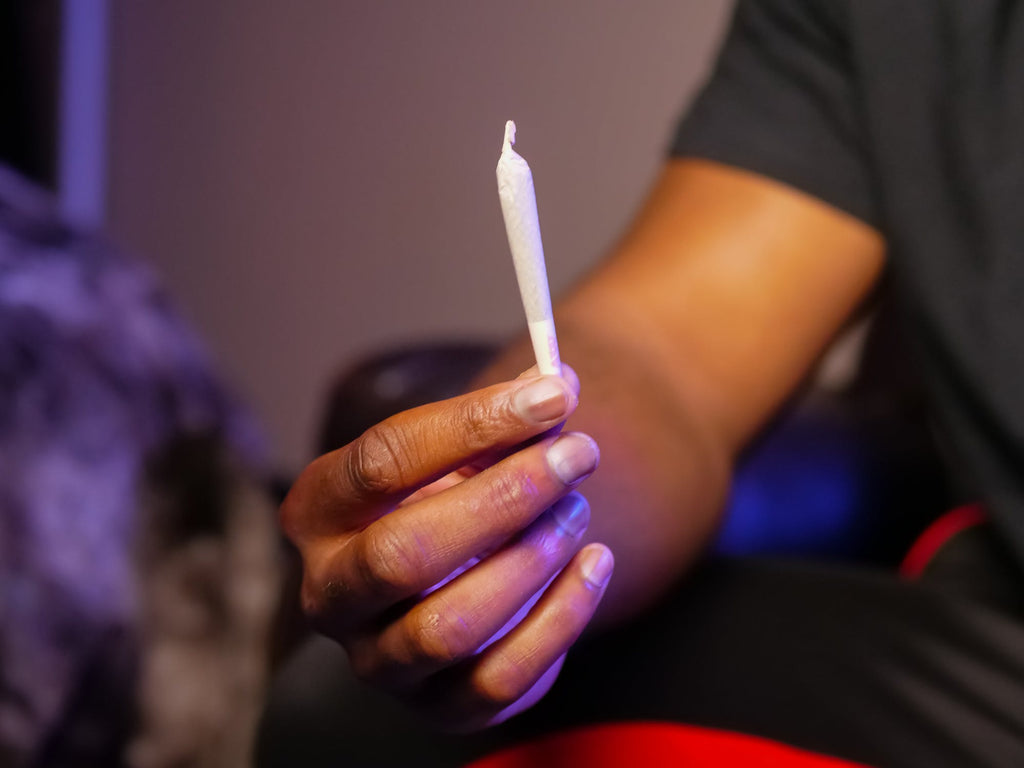 Pre roll joint being held