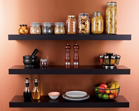 jars and kitchen appliances on black shelves