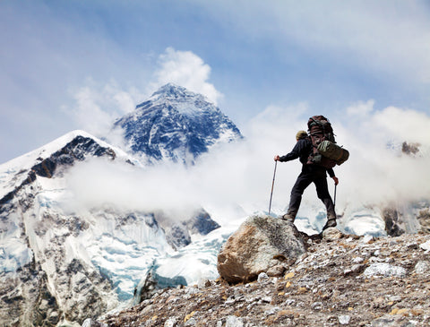 someone hiking with gear bag