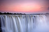 Poster Wasserfall Bei Abendroete Hochformat Crop