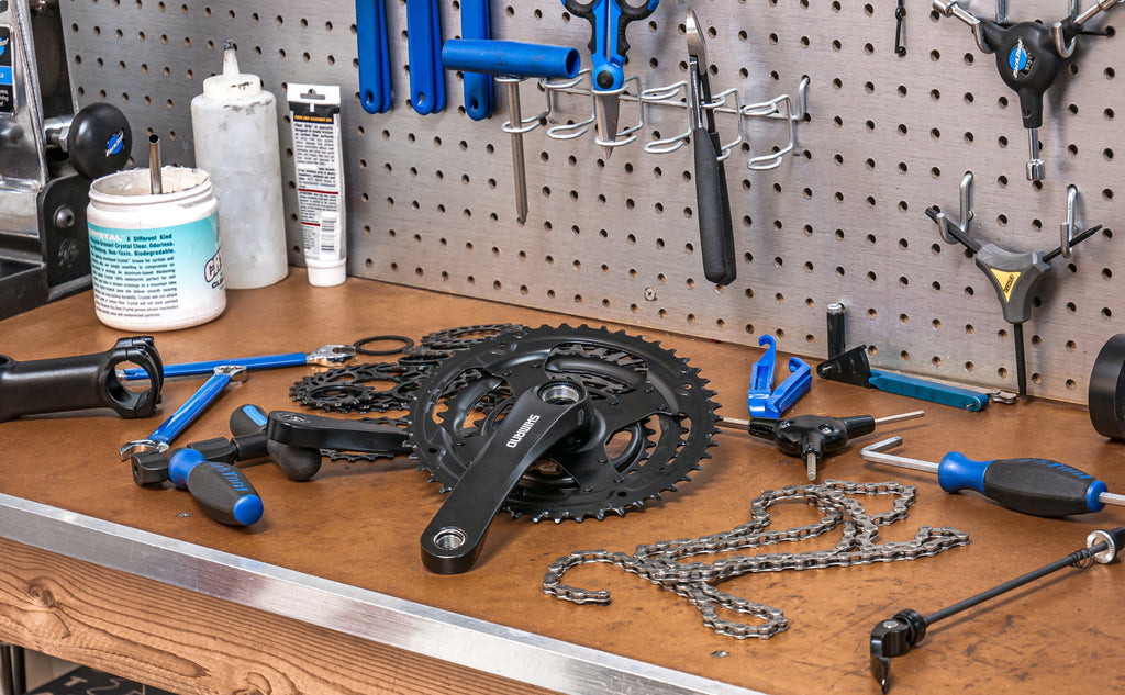 A work bench with tools for fixing electric bikes