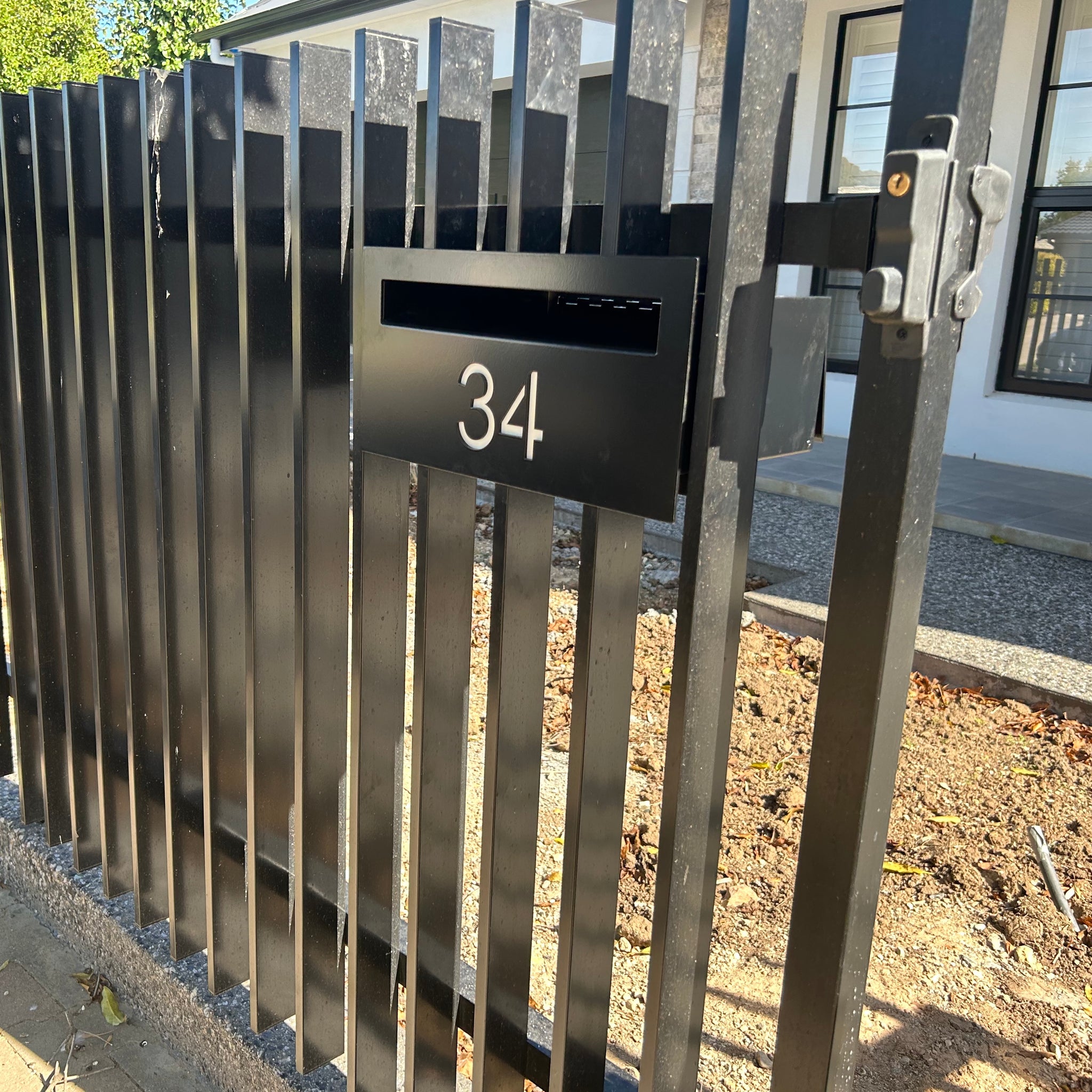 custom faceplate letterbox option 1 installed in metal tube fence