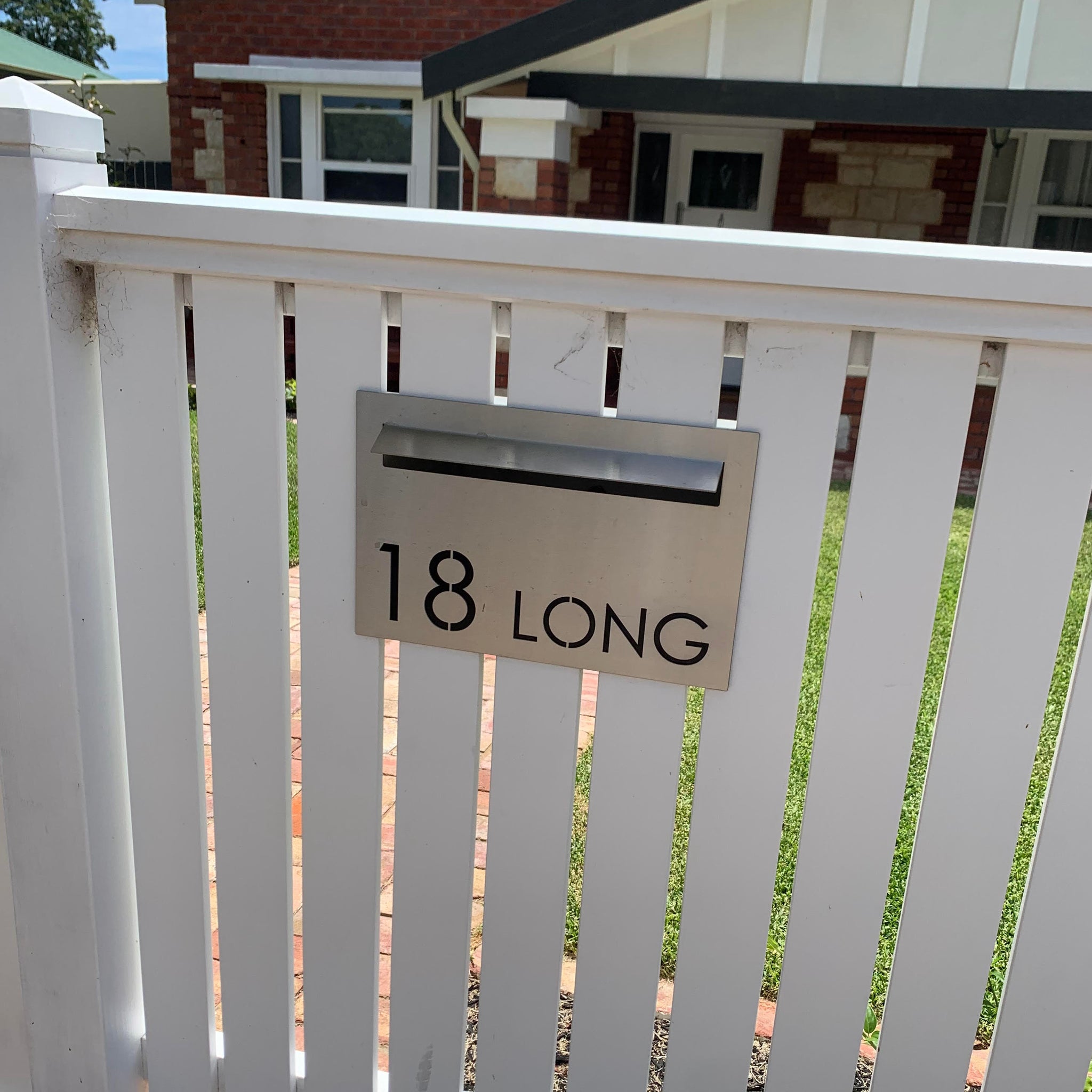 custom letterbox faceplates option 2 installed in picket fence