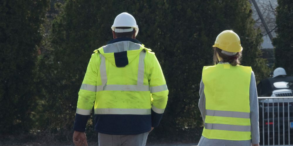 people wearing different safety jackets