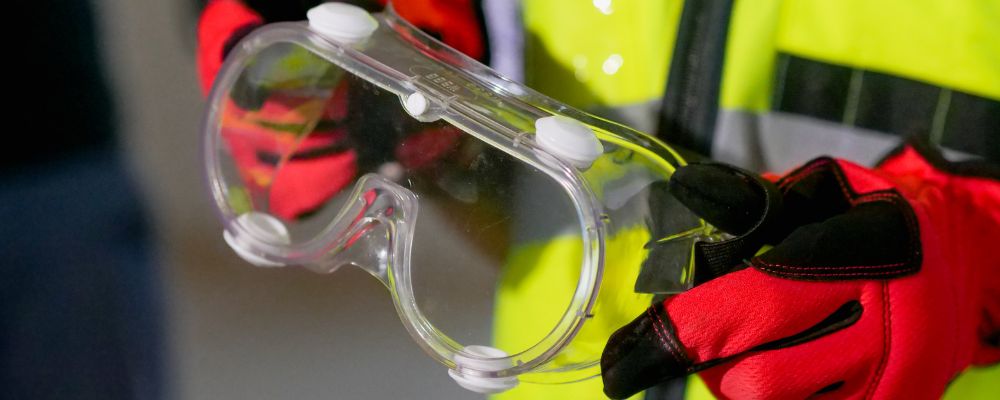 worker in construction work wearing safety glasses