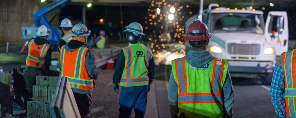 construction worker wearing custom safety vest which identify the work role