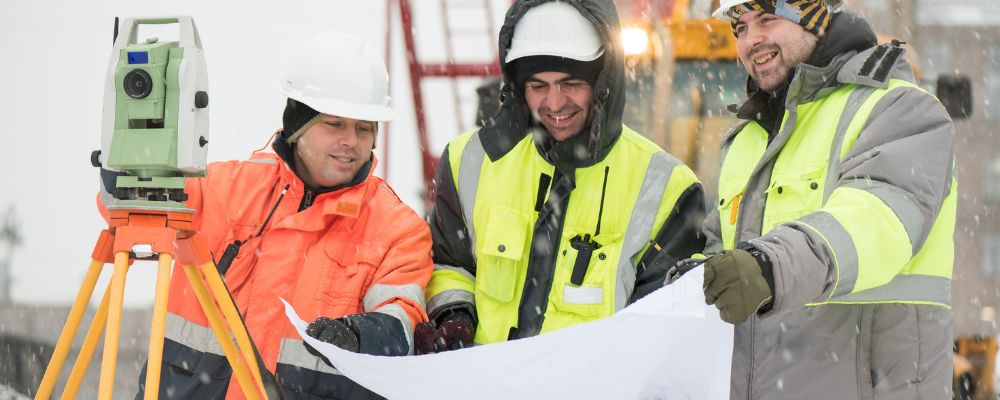 workers wearing safety jacket in winter