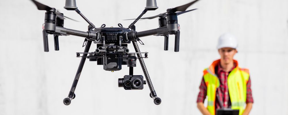 operating drone wearing hi-vis drone pilot vest