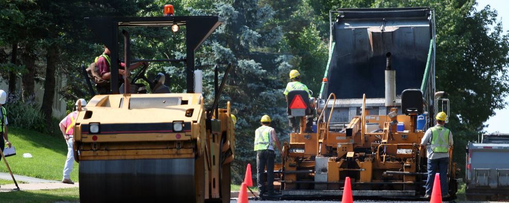 road workers wearing safety vests in summer