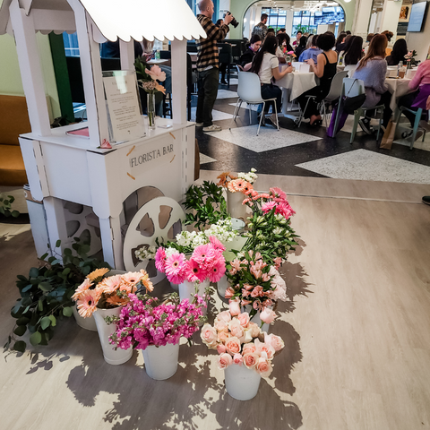 A flower cart with fresh flowers