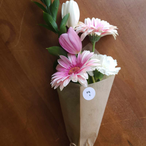 a mini bouquet of flowers wrapped