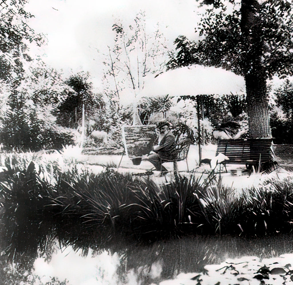 Claude Monet historic photograph of the artist painting in his garden at Giverny