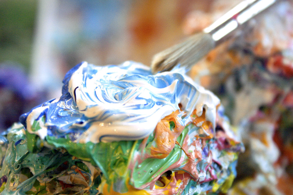 John Dyer mixing paint on his palette