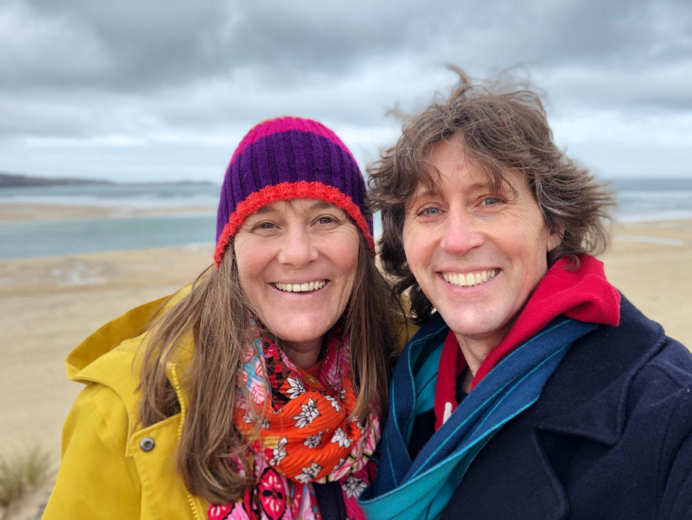 Artists John Dyer and Joanne Short standing on the beach at Gwithian