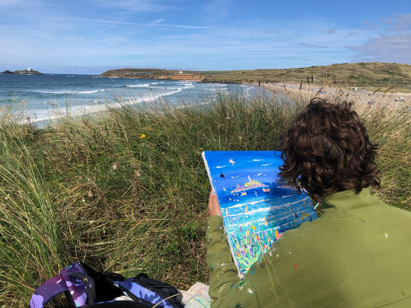 Cornish artist John Dyer painting a seascape at Gwithian on the North Coast of Cornwall