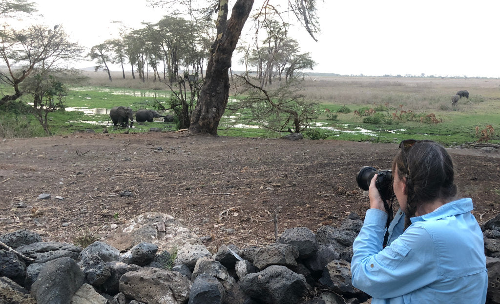 Artist Joanne Short photographing wild elephants in Kenya