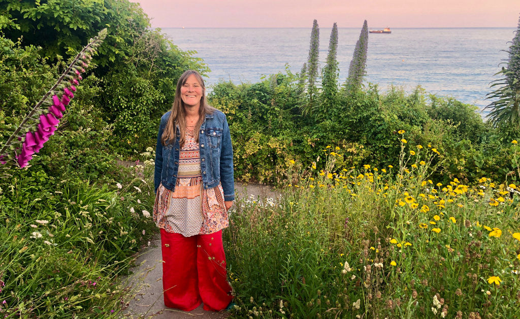 Emerging artist Joanne Short pictured on the coast path at Falmouth in Cornwall as she looks for inspiration for her new paintings