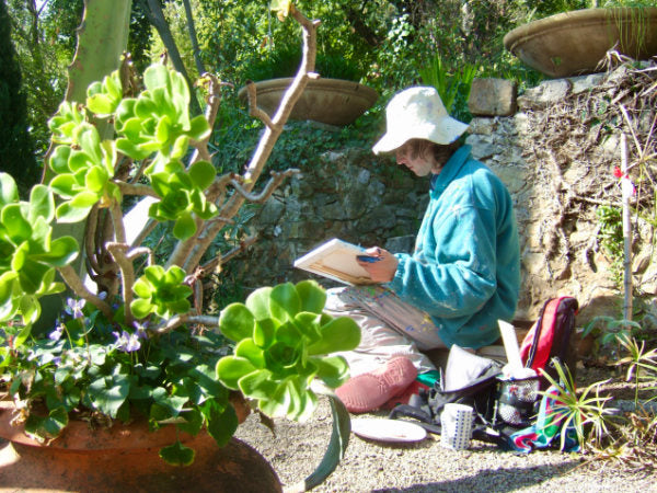 Artist John Dyer painting in the garden of the Clos du Peyronnet in Menton France