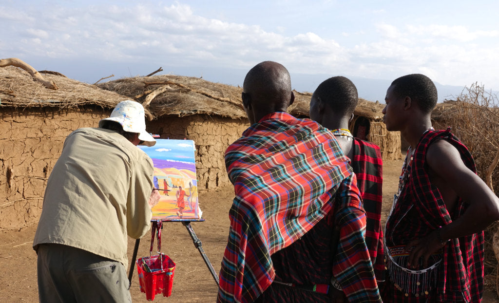 British artist John Dyer painting the Maasai tribe in the Cultural Boma in Amboseli, Kenya, Africa