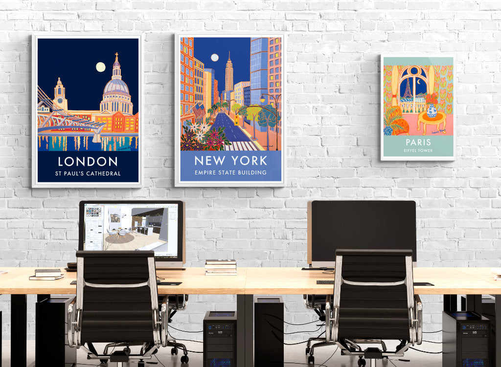 Wall art decor featuring paintings of cities by Joanne Short in an office setting