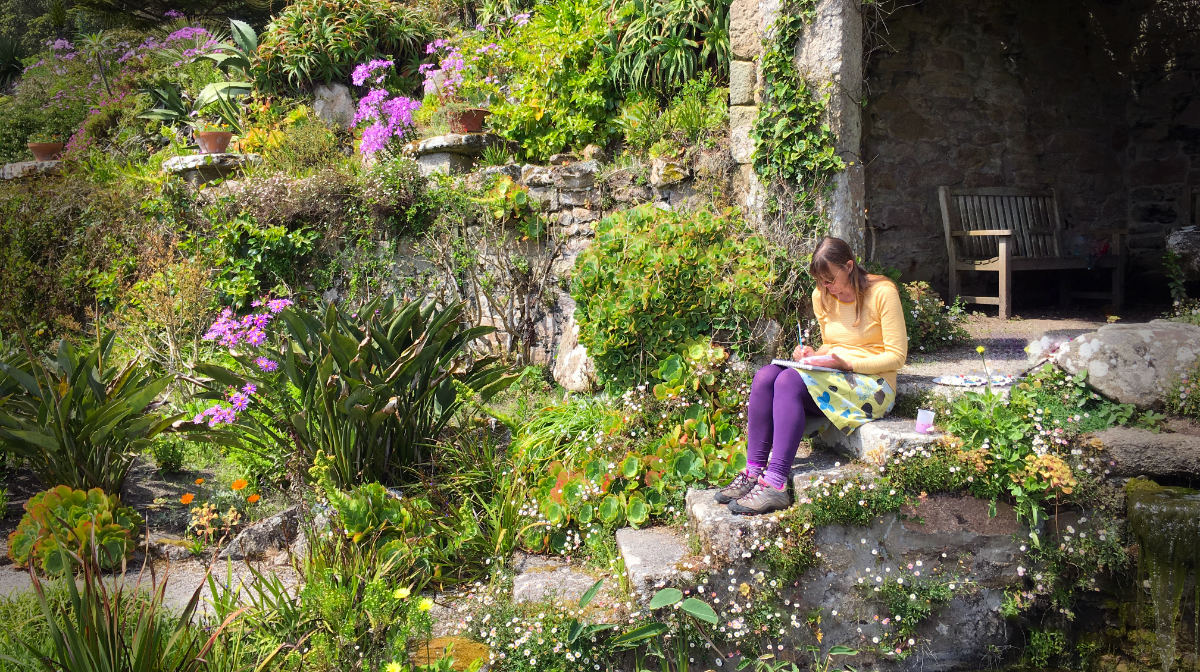 Cornish artist Joanne Short painting in the Tresco Abbey Garden on the island of Tresco.