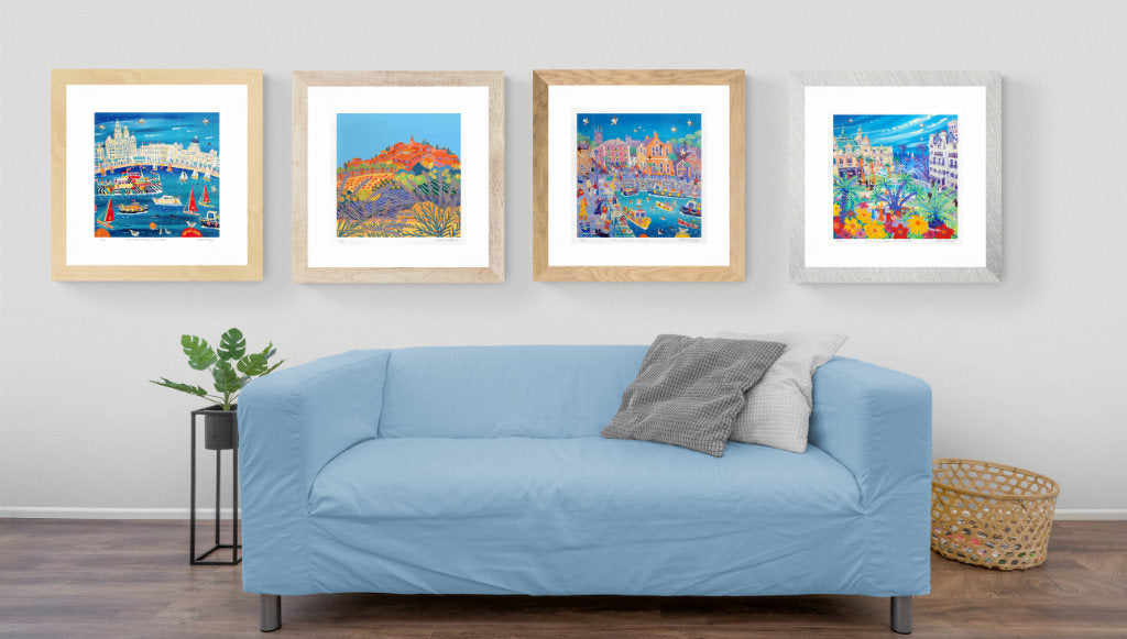 Framed signed prints on a lounge wall