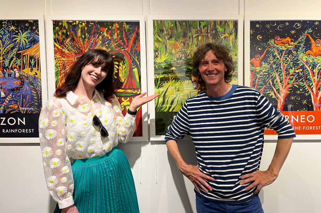 Georgina Green the artists liaison officer from Procreate with John Dyer at the Royal Geographical Society in London during the Last Chance to Paint exhibition in 2023