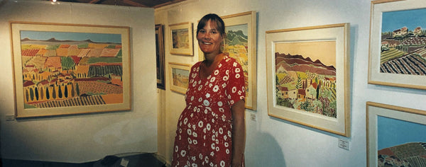 Artist Joanne Short with her collection of oil paintings of Provence