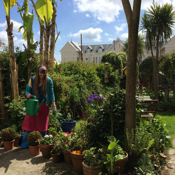 Artist Joanne short tending her seaside garden in Cornwall