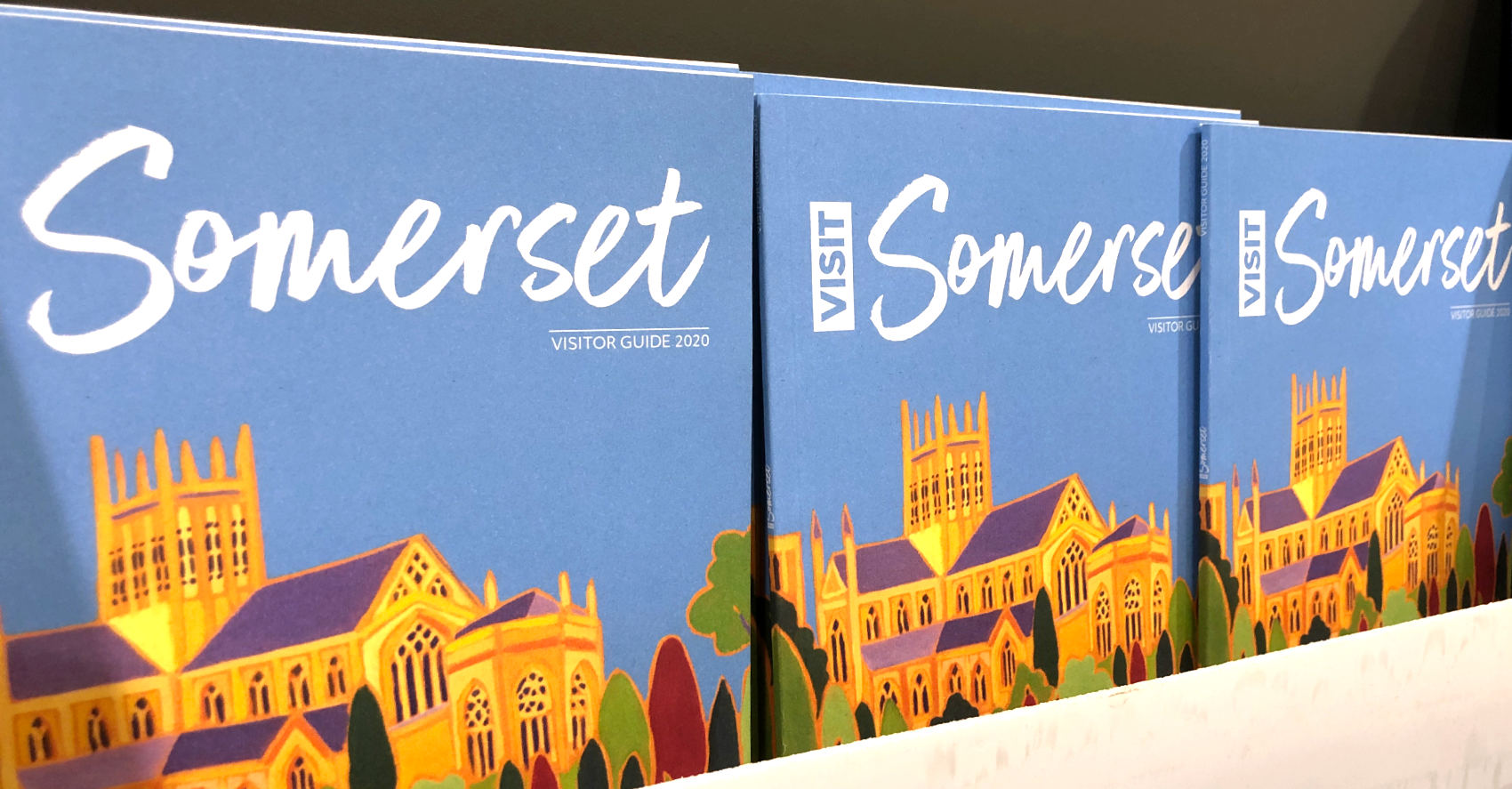 Visit Somerset visitor guides featuring art by Joanne Short on display in Wells