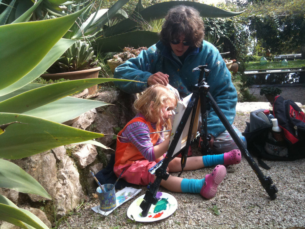 photograph of artist John Dyer with his daughter, Wilamena,painting in the gardens of Le Clos du Peyronnet