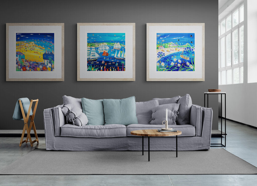 Three John Dyer artist prints framed in a neutral decor interior