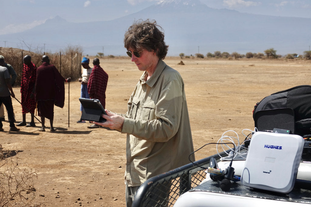 Artist John Dyer pictured preparing the equipment to record his day with the Maasai tribe in Kenya.