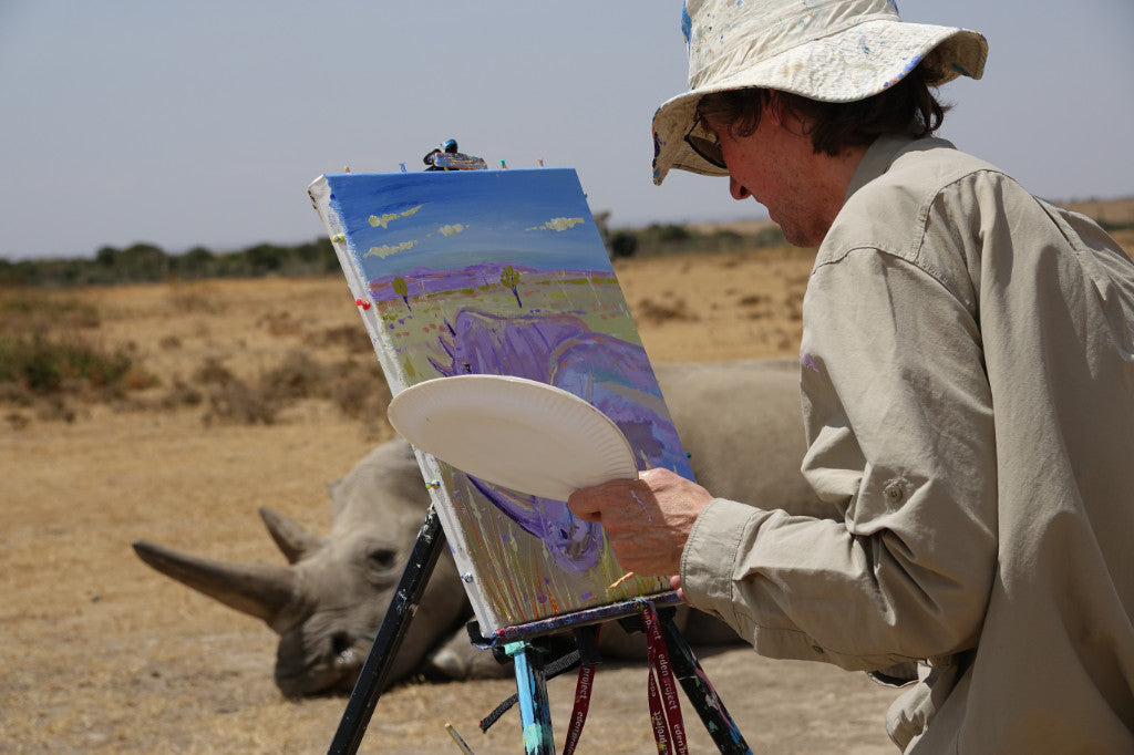 John Dyer at work painting the last two Northern White Rhinos in Kenya, Africa