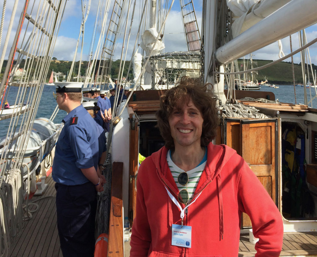 Artist John Dyer pictured onboard a Tall Ship in Falmouth Bay