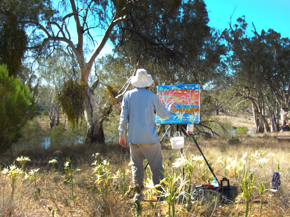 Artist John Dyer painting in the Australian outback at Banrock Station