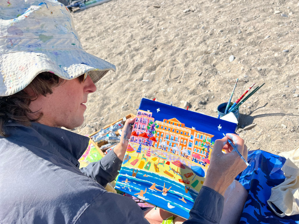 John Dyer painting on the beach in Menton, France