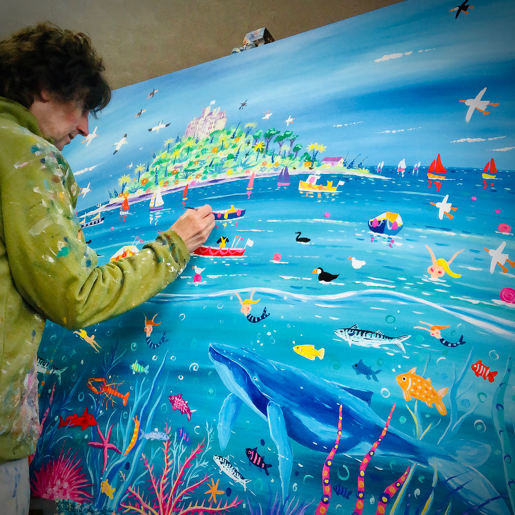 Cornish artist John Dyer at work on his large painting of a humpback whale in Mount's Bay in Cornwall