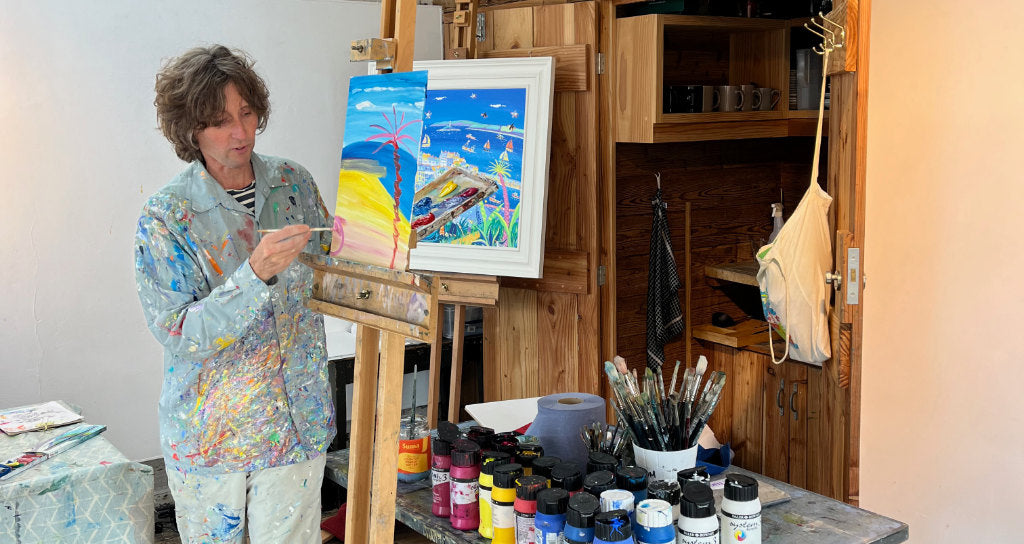 St Ives artist John Dyer painting in the Porthmeor studios for the St Ives School of Painting children's workshop.