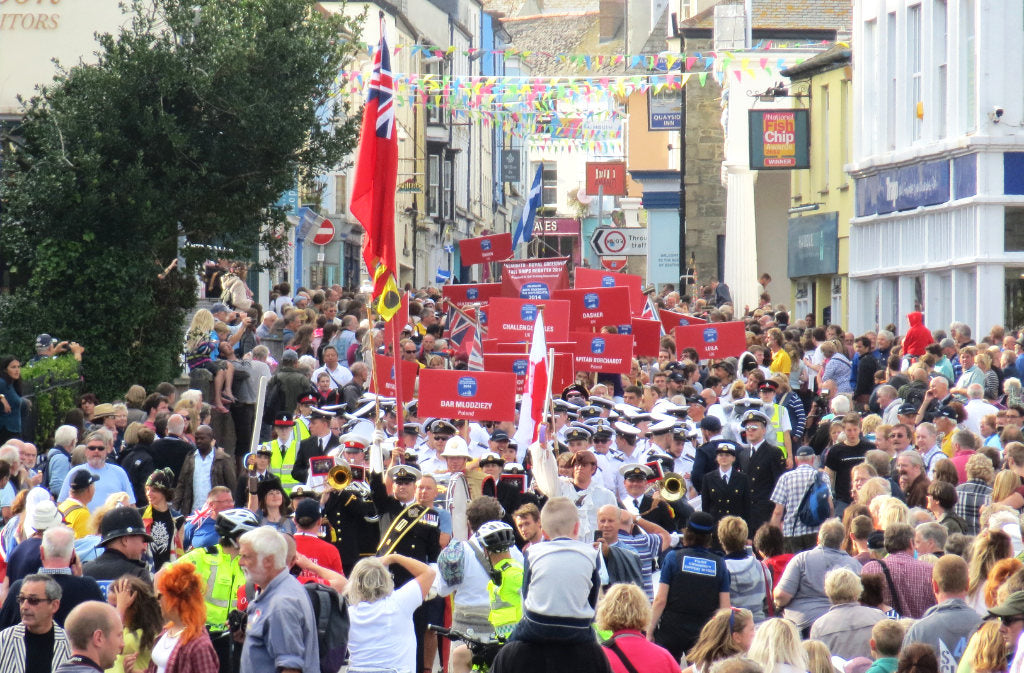 Over 100,000 people gather in Falmouth and bands and sailors parade through the town
