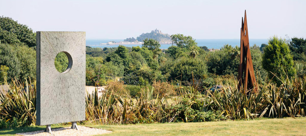 A view across the Tremenheer Sculpture Gardens towards St Michael's Mount in Cornwall. Photo courtesy of the gardens.